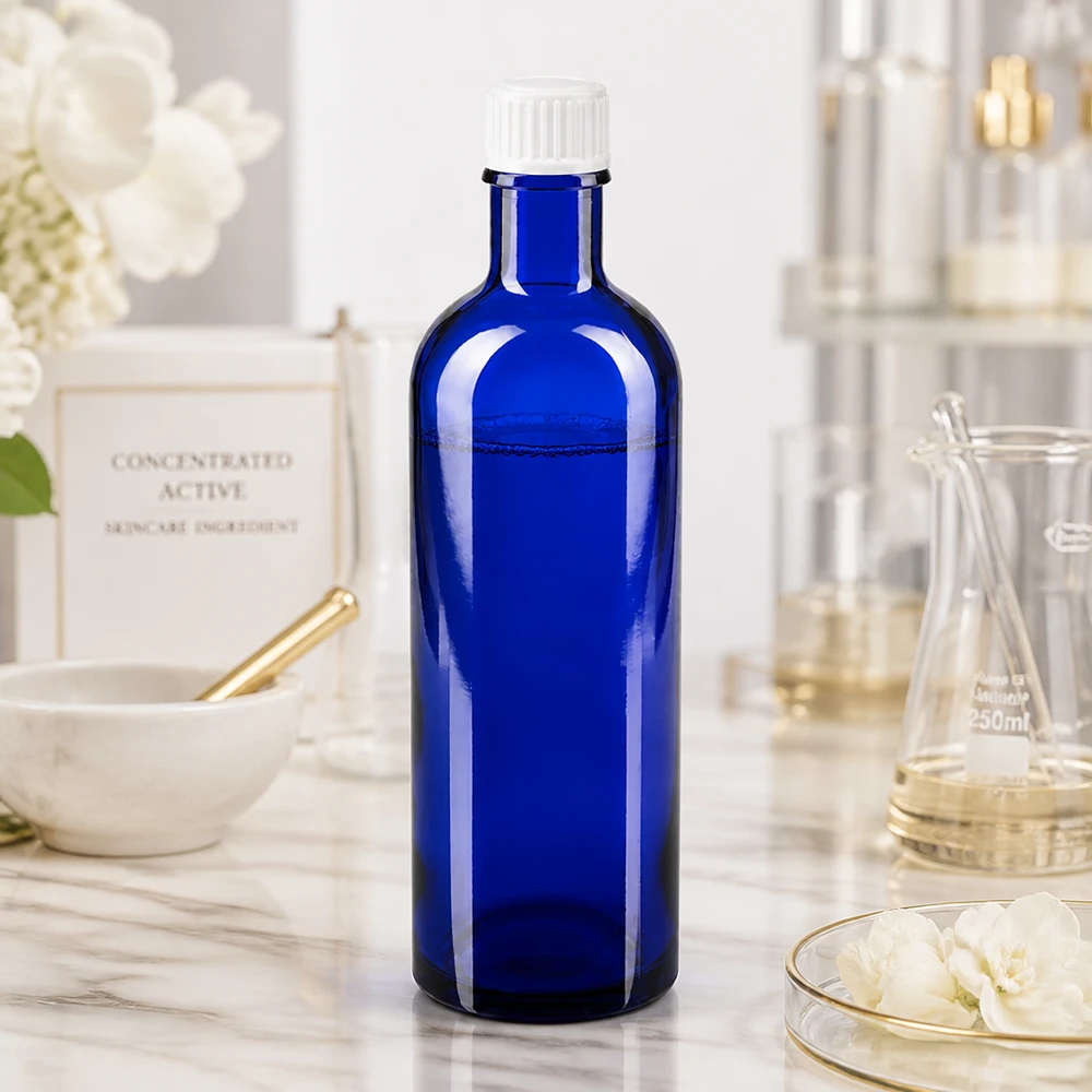 Frasco de farmácia azul cobalto de 200 ml com proteção UV, em vidro borossilicato e com tampa branca