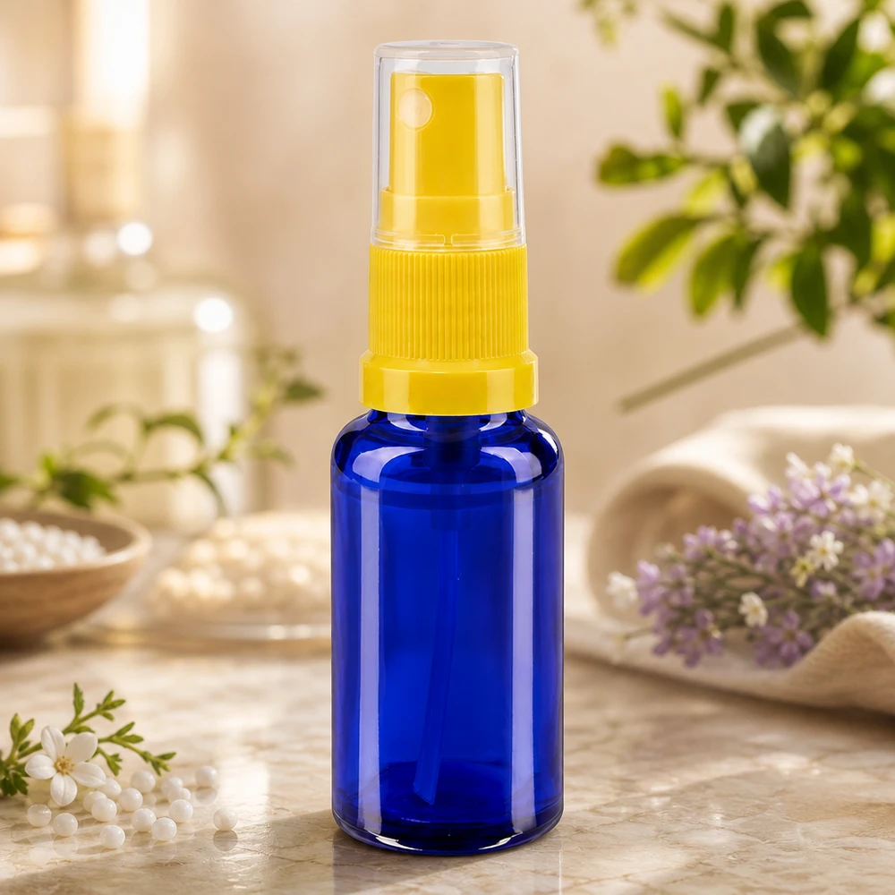 Frasco pulverizador compacto de 20 ml em vidro azul com proteção UV e cabeça de bomba amarela para farmácias