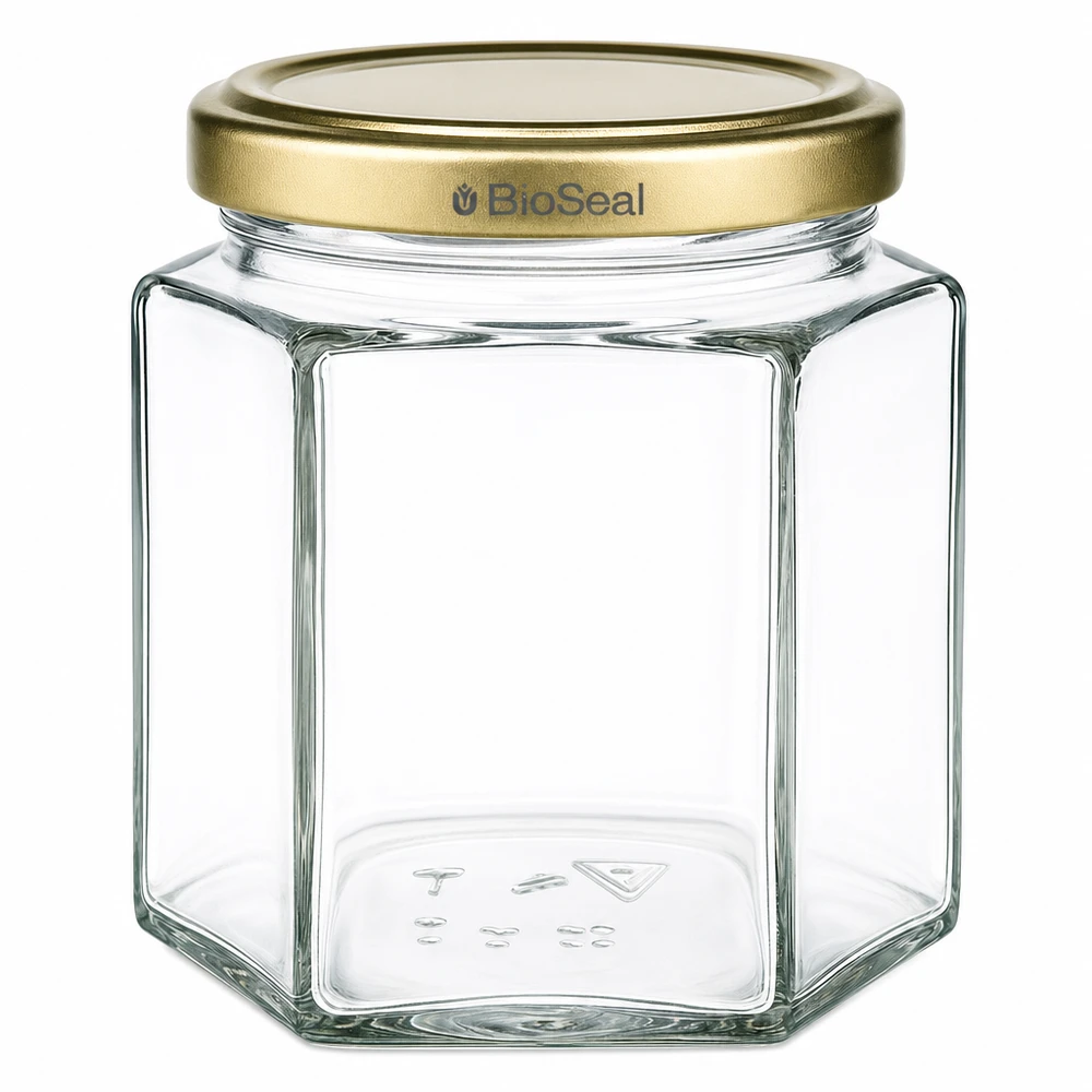 Frasco de mel de 520 g hexagonal transparente com tampa dourada BioSeal para apicultores e engarrafamento de mel
