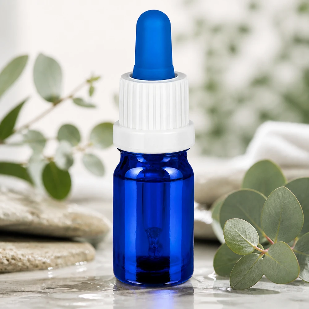 Frasco pequeno de pipeta de 5 ml em vidro azul com tampa branca ergonómica com conta-gotas