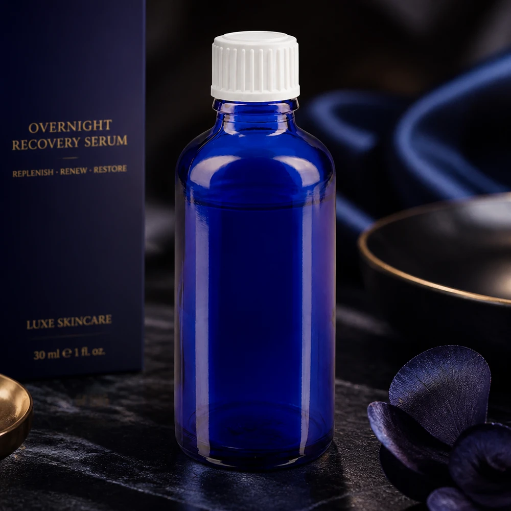 Frasco conta-gotas cilíndrico azul cobalto de 50 ml, fabricado em ApoGlas, com tampa de rosca branca para soros