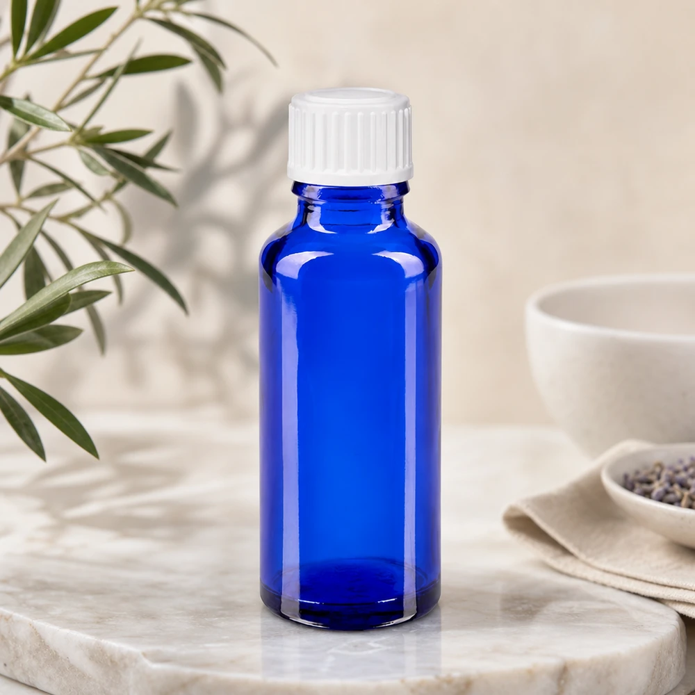 Frasco cilíndrico de farmácia de 30 ml em azul cobalto com tampa padrão branca de 11 mm