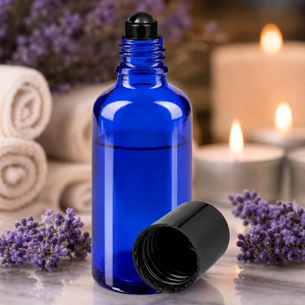 Frasco de farmácia azul 50ml tampa roll-on preta Frasco roll-on de 50 ml em vidro de proteção azul cobalto com aplicador esférico preto para aromaterapia