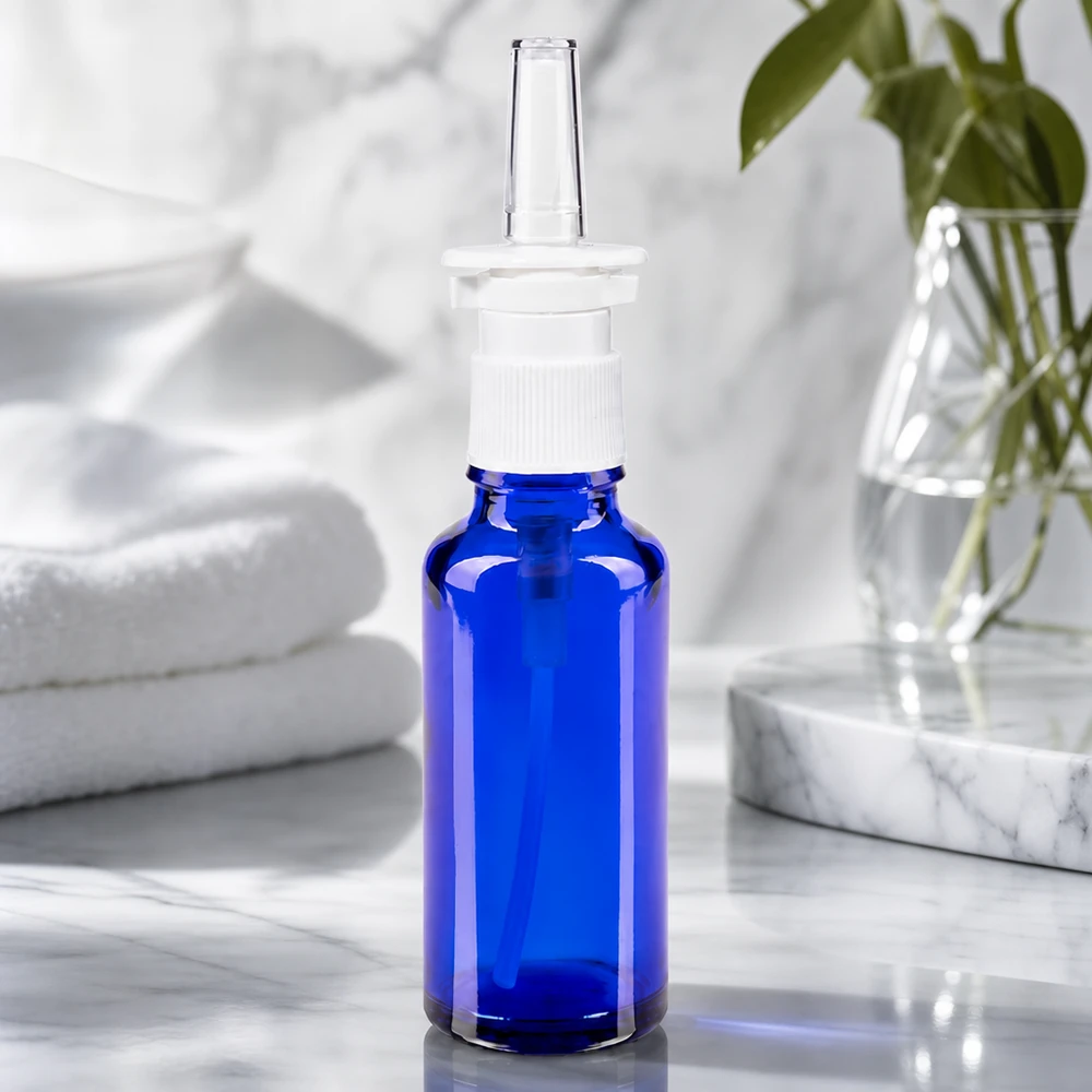 Frasco de farmácia azul 30ml atomizador nasal branco padrão Frasco de spray nasal de 30 ml em vidro azul cobalto com bico dosador branco para aplicações farmacêuticas