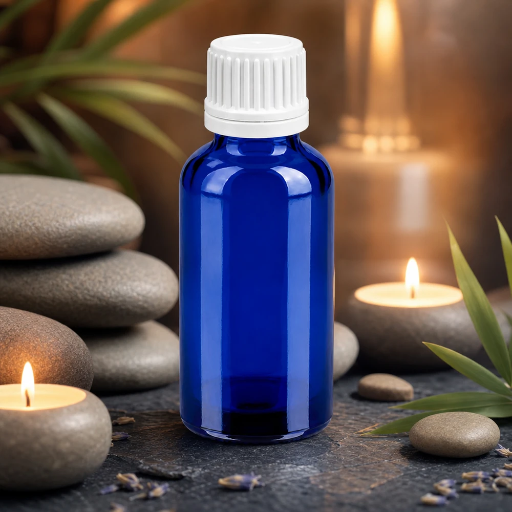 Frasco compacto de 30 ml em vidro azul com tampa branca para uma dosagem precisa de líquidos